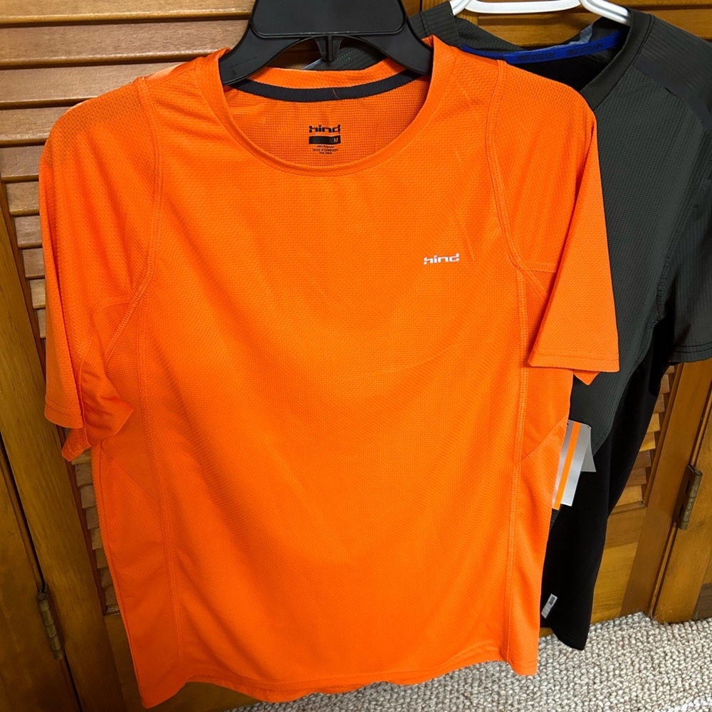 Orange Hind running t-shirt plus black RBX running shirt.  Brand new. Medium.